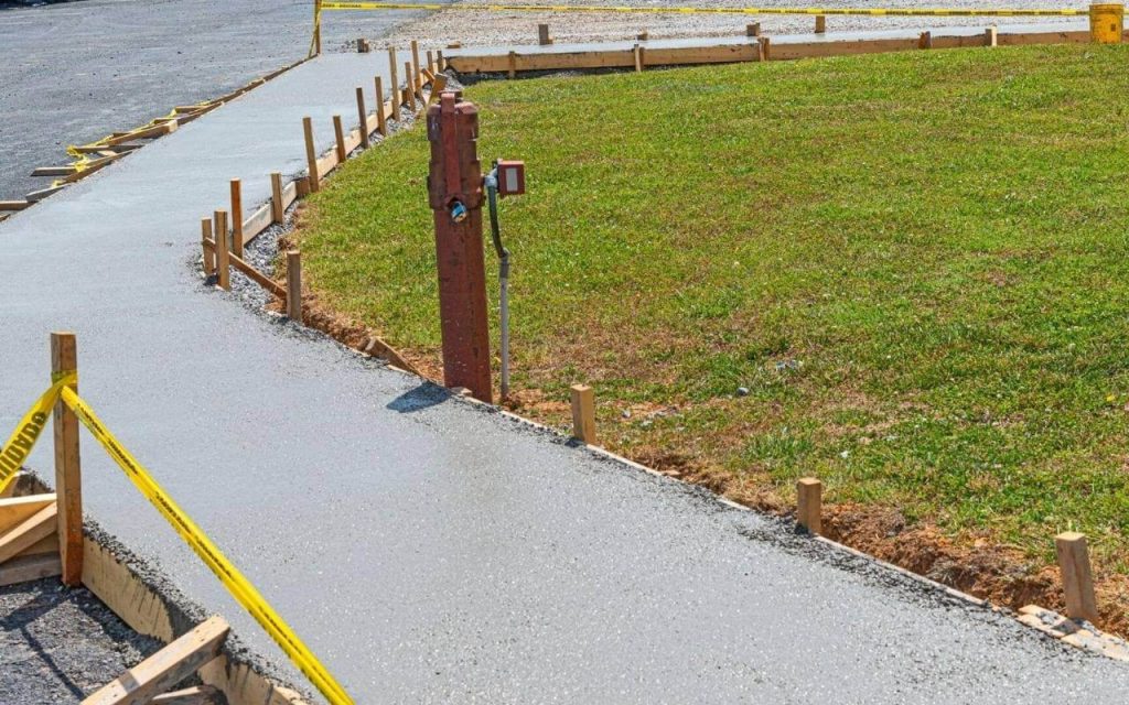 Reef Concrete Contractor Richardson's Staff working on a Concrete Sidewalk project in Richardson TX